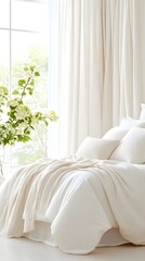A pristine white bed with plush bedding and a throw blanket, bathed in soft natural light from a window