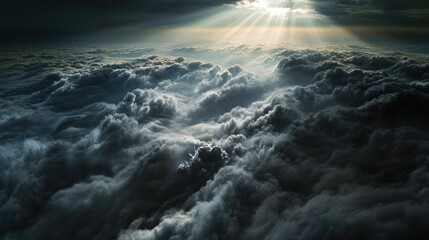 Dramatic view of dark clouds illuminated by sunlight.