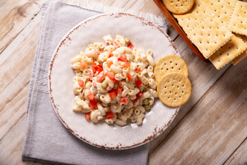 Macaroni salad with elbow pasta and canned tuna, served with saltine crackers. Easy and healthy recipe.