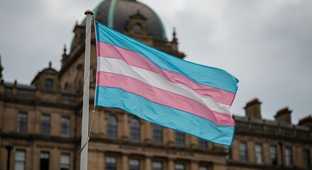 Transgender Pride Flag Waving Against Old Stately Building Symbolizing Inclusivity and Celebration During Pride Month with Diffused Lighting Enhancing Colors Creating Empowering Atmosphere