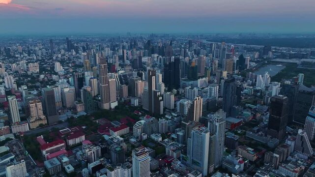 Captivating aerial view of Bangkok skyline at dusk highlighting urban vibrance and architectural marvels