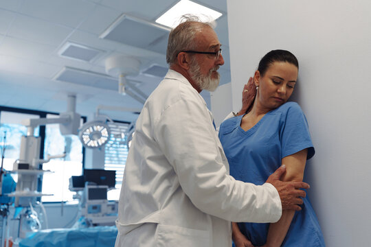 Inappropriate behavior between senior doctor and female nurse. Workplace harassment.