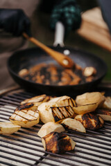 Grilling apples on outdoor BBQ for homemade dessert