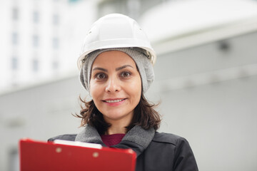 technician female working with helmet outside