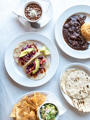 Table with spread of Mexican food at restaurant