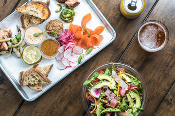 Overhead view of healthy food spread and beer