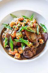 Sausage and shrimp gumbo in bowl vertical