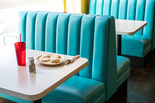 Blue booths in diner with biscuits and gravy
