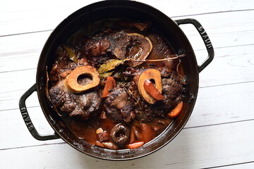 cooking meat in a pan