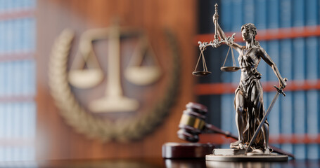 Legal Concept: Themis is the goddess of justice and the judge's gavel hammer as a symbol of law and order on the background of books