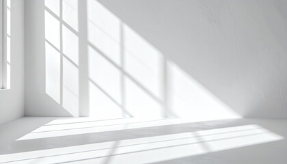 Fototapeta premium Bright, minimalist interior with sunlight casting shadows through windows, creating a serene and calm atmosphere