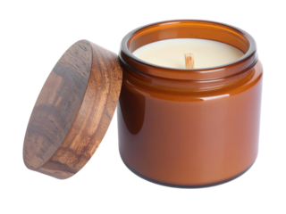 Warm glow and cozy scents, a small jar of orange scented candles illuminates the room