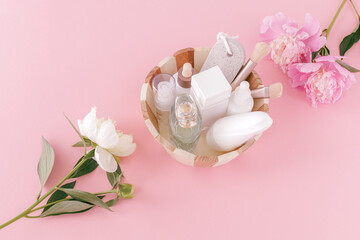 Women cosmetics and spa set in the wooden basket.