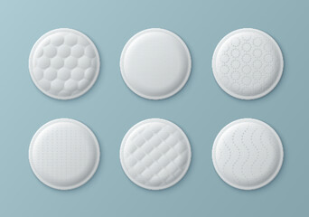 Set of white round cotton pads with different embossed surface textures - waffle, honeycomb and dotted patterns. 3d realistic cosmetic sponge discs top view for skincare and makeup remove concept.