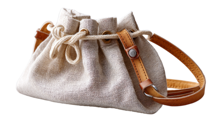 Stylish linen drawstring bag with leather strap on white background.