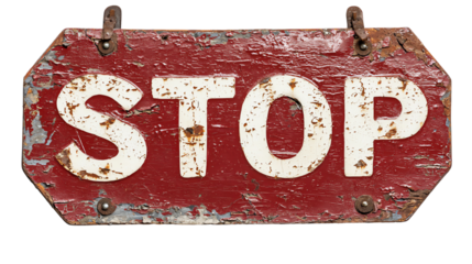 Vintage weathered stop sign with white letters on a red background.