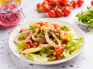 salad with squid, cucumbers, tomatoes and corn