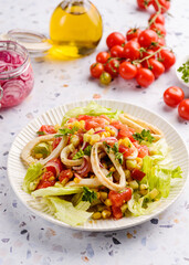 salad with squid, cucumbers, tomatoes and corn