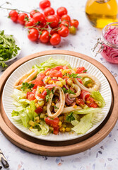 salad with squid, cucumbers, tomatoes and corn
