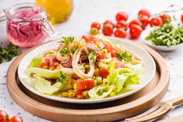 salad with squid, cucumbers, tomatoes and corn