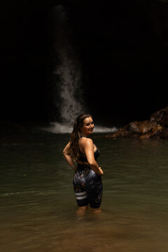 Woman in front of waterfall on the island of Bali