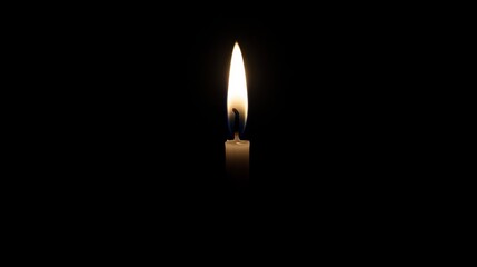 A single candle in the dark.