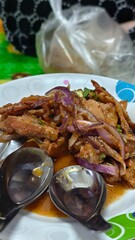 Deliciously Spicy Fried Meat with Onions and Herbs Perfect for Culinary Enthusiasts