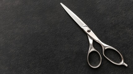 A pair of silver scissors with black handles.