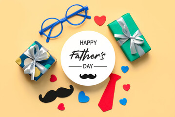 Top view of gift boxes,hearts,false mustache,bow tie and round blank with the text Happy Father's...