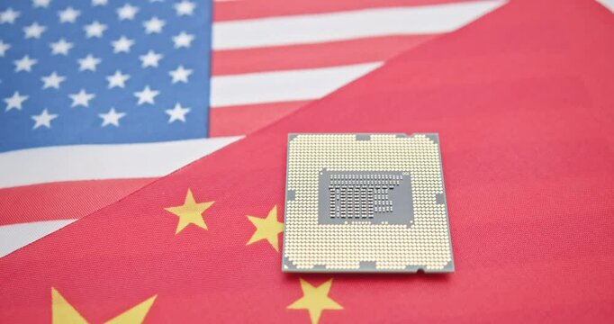 Tech warfare: A microchip on the U.S. and China flags symbolizes the escalating technological rivalry, reflecting their strategic competition in semiconductor innovation, and supply chain dominance.