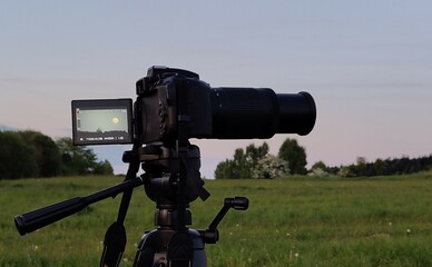 a camera in a tripod