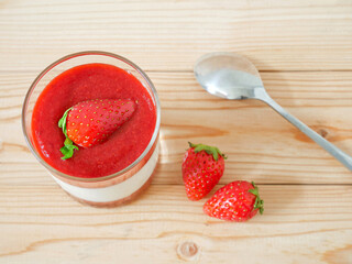 Panna cotta with strawberry coulis and fresh strawberry