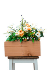 Flowers in wooden box isolated on white background