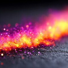 Vibrant abstract texture with glowing sparkles and colors.