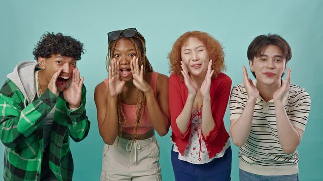 Group of diverse Generation Z friends posing on isolated blue screen.