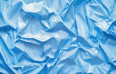 Obraz premium Light blue, crinkled plastic material. Close-up view of folds and wrinkles