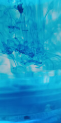 abstract image of blue droplets in water