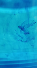 abstract image of blue droplets in water