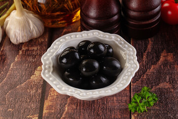 Mediterranean marinated Black olives in the bowl