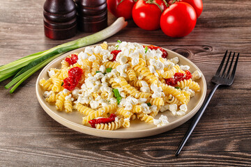 Italian pasta fusili with curd