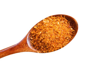 close-up of wooden spoon with red chili powder isolated on white background