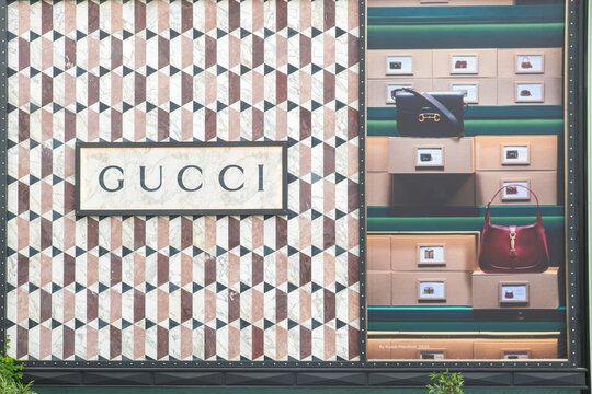 Bangkok, Thailand - February 20, 2025: Gucci storefront with marble geometric wall pattern and luxury handbag display advertisement in shopping mall in Bangkok city. Luxury fashion boutique exterior