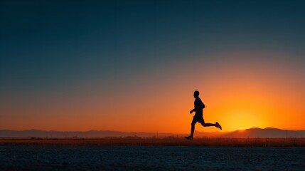 Silhouette of a Man Running at Sunset in a Field, Healthy Lifestyle Concept with Copy Space