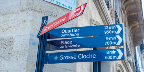 Signpost showing walking routes to the Saint-Michel district, Place de la Victoire and the Grosse...