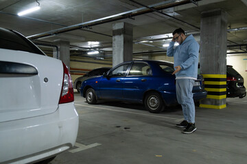 Person in Underground Parking Garage Figure Out of Stolen Car