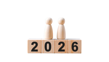 a visual representation of the year 2026 with wooden figures. The wooden figures stand atop blocks that spell out the year 2026, set against an unobtrusive backdrop.