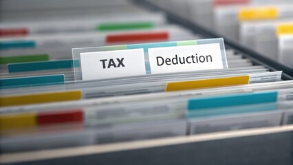 Organized folders labeled for tax deductions in a filing system. Concept of Tax deduction advisor