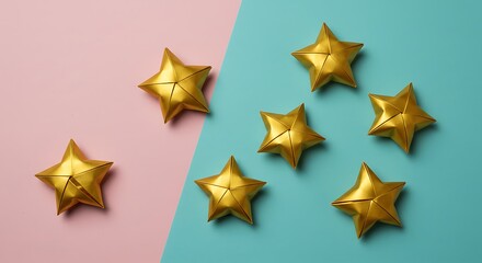Golden star ornaments on pink and blue background