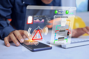 Alarm monitoring machinery breakdown with engineers being alerted via smartphone that the...