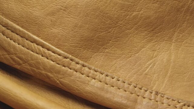 Stitch pattern on Brown Leather fashion jacket texture CLOSE-UP